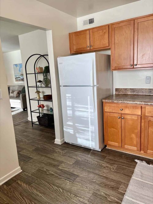 Kitchen Features Refrigerator, Cabinetry & Countertops